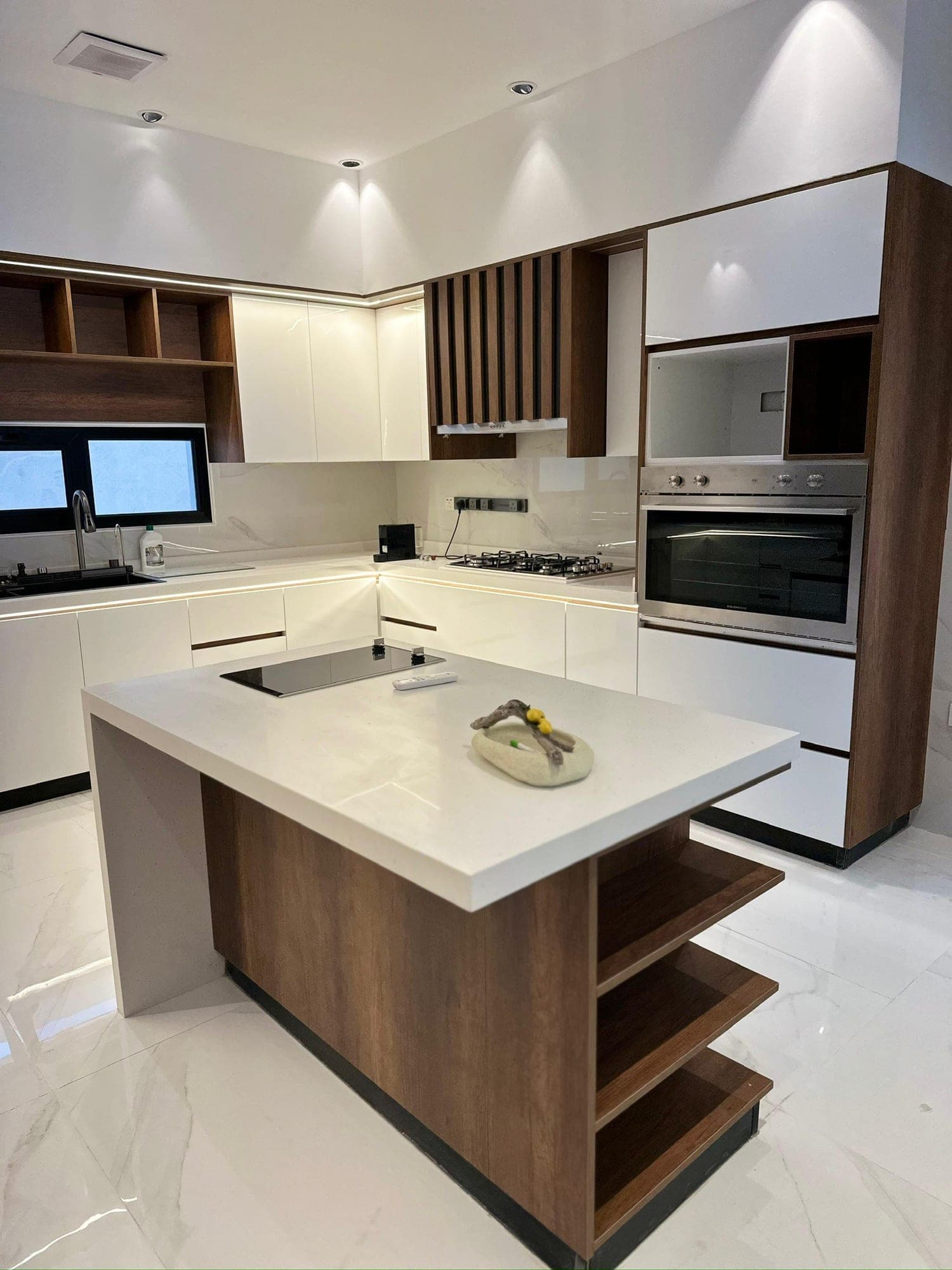Kitchen with a wooden island and white marble top — built from a Blum for Kitchens 3D design
